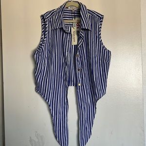 It’s a girl blouse size medium never worn ties in the front